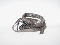 Handmade bag made of upcycled silk kimono and encased in a hand-knotted paracord. The fabric features black and white all-over print. The strap includes grommets and a carabiner for adjustability.